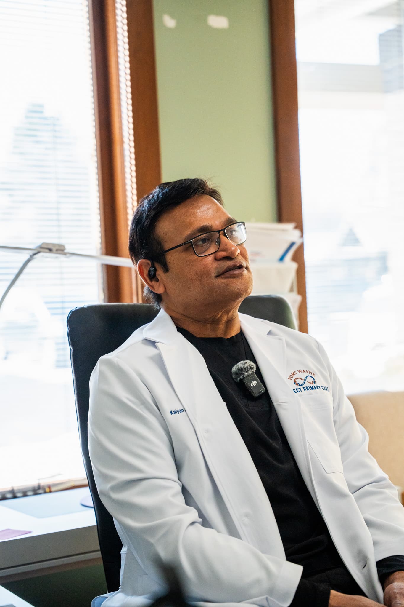Dr. Kalyan Aluri reviewing notes with a patient